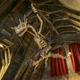A dragon skeleton inside the Defense Against the Dark Arts classroom, which is part of the queue inside Hogwarts.